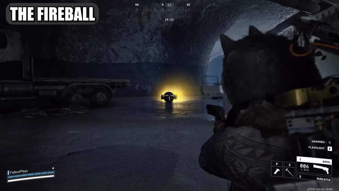 Third-person view of the player aiming at a glowing fireball enemy that has rolled up and is emitting a bright yellow glow in a tunnel.