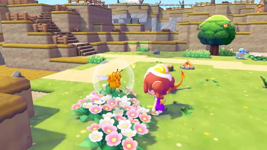 Player character standing by flowers as a Pok&eacute;mon appears in a bubble with other Pok&eacute;mon visible in the background
