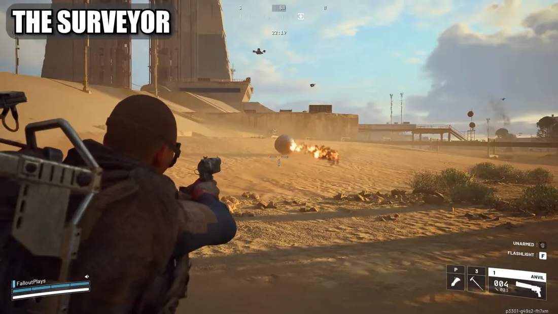 Third-person view of the player aiming at a rolling Surveyor sphere leaving a trail of fire across a sunlit desert landscape.