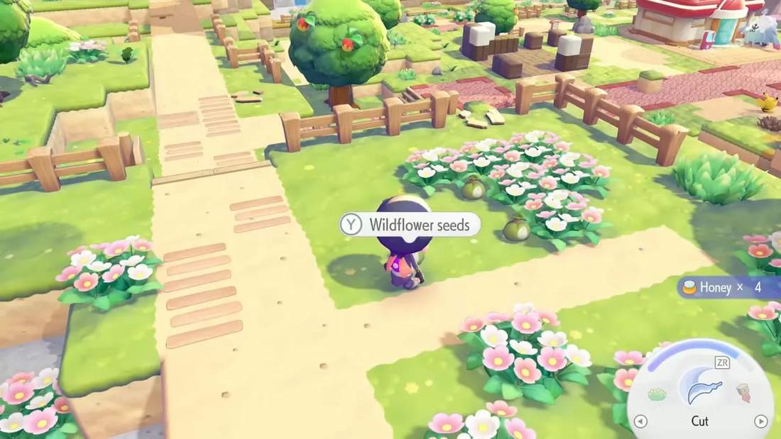Prompt showing ability to pick up wildflower seeds next to a pink flower bed