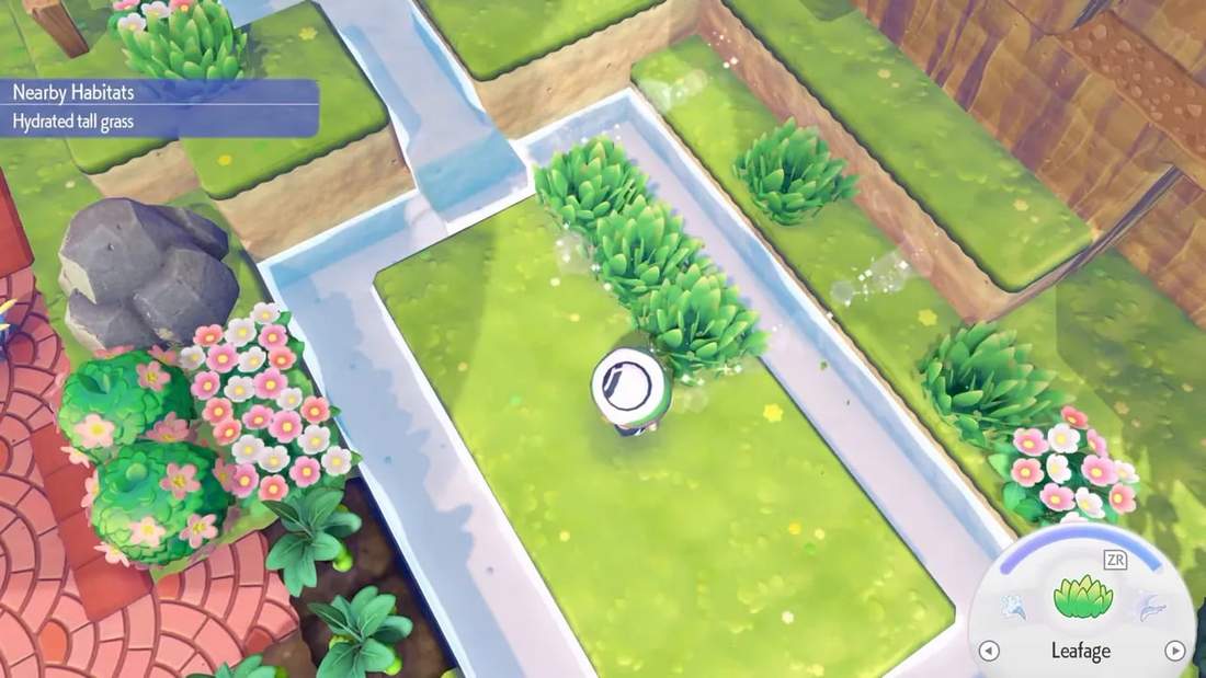 Top-down in-game view of hydrated tall grass patches along a narrow water channel with the Nearby Habitats label and the player visible