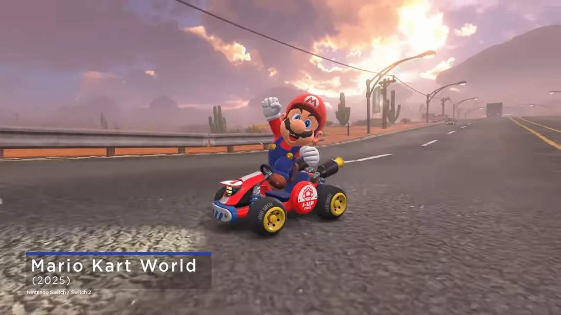 Mario waving while driving a red kart on a desert highway in Mario Kart World, with the on-screen title visible.