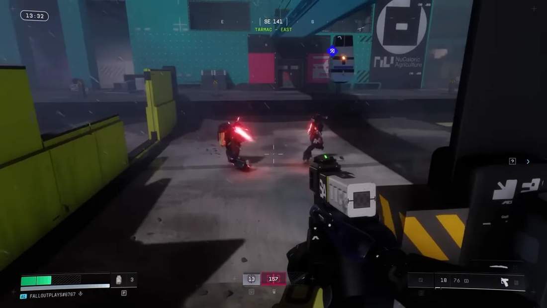 First-person view aiming at two enemy runners with red energy effects in an open Tarmac area, HUD visible.