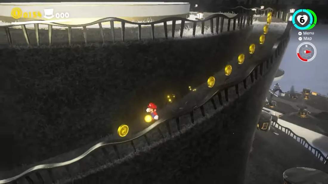 Mario running along a cliffside path collecting coins in Super Mario Odyssey