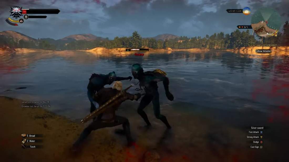 Geralt fighting drowners in shallow water near a lake in The Witcher 3
