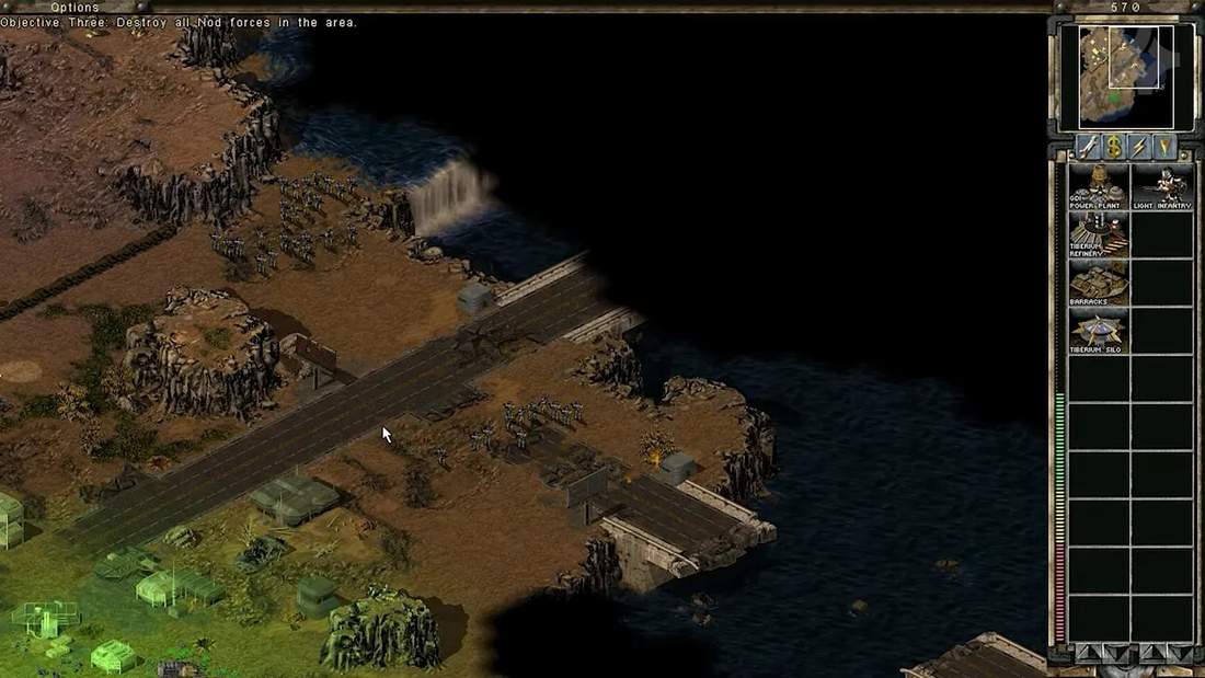 Command &amp; Conquer: Tiberian Sun gameplay view of a riverfront base with HUD
