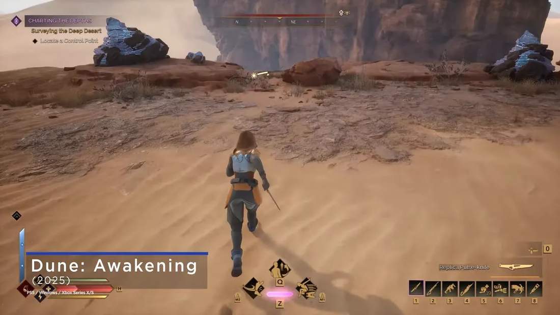 Dune: Awakening gameplay screenshot in the desert with HUD elements and a character running toward rocks and sand