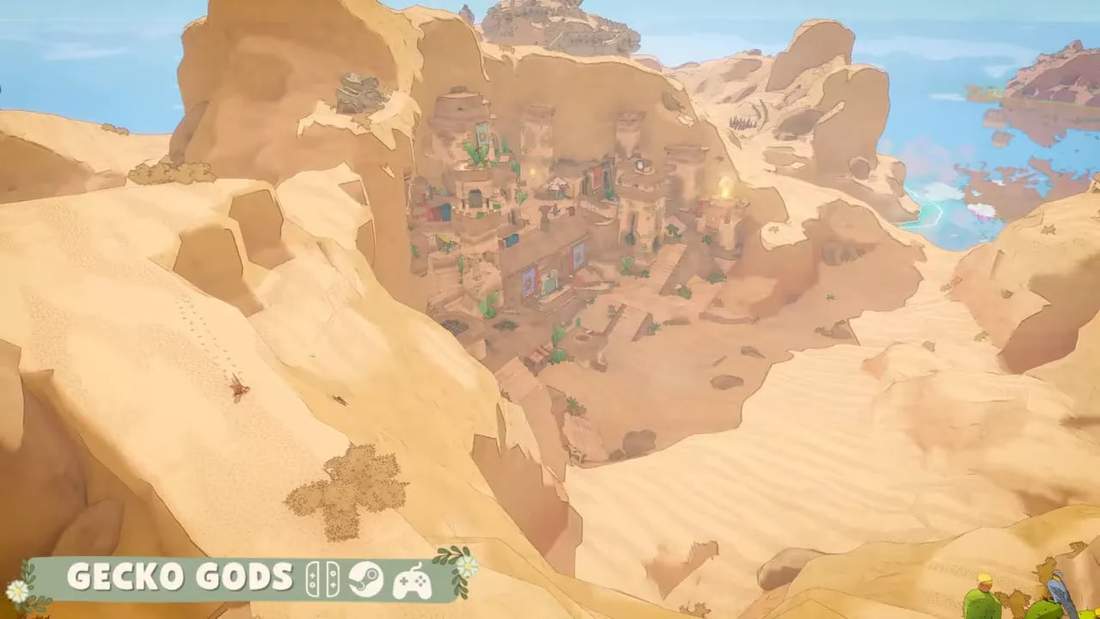 Gecko Gods gameplay view showing an island settlement from above with desert cliffs and ocean in the distance