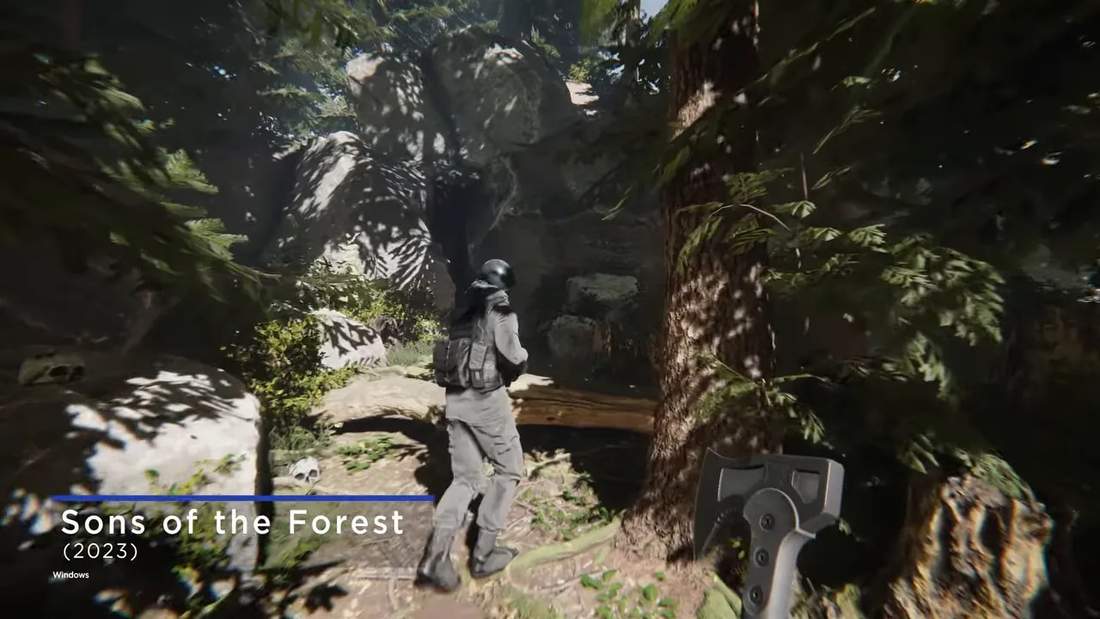 First-person view running through a forest cave entrance in Sons of the Forest with weapon visible