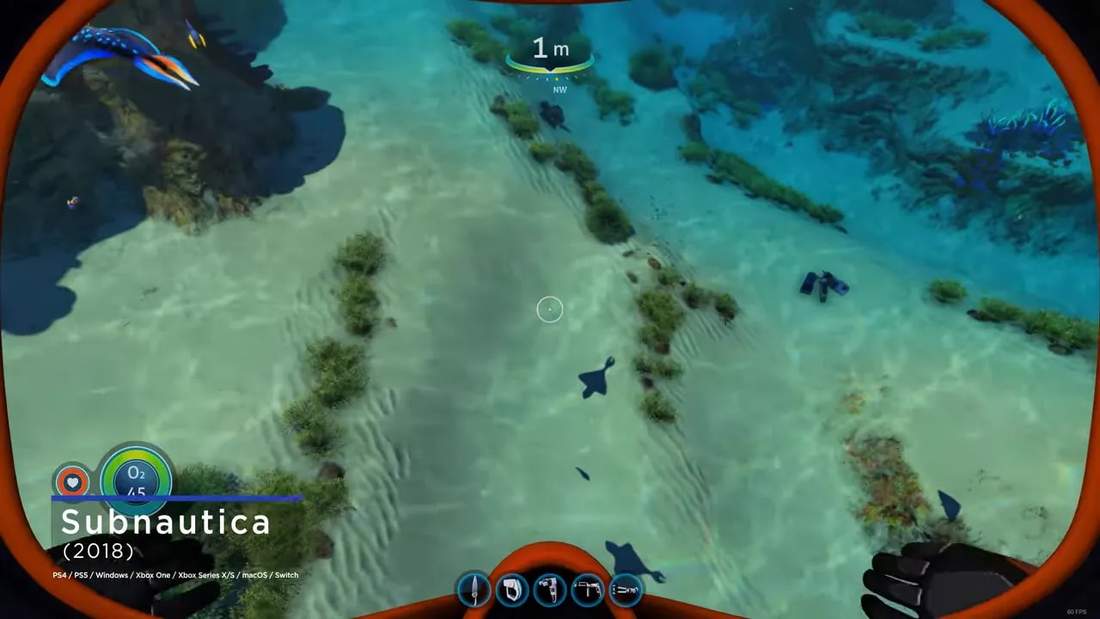 Subnautica gameplay underwater showing shallow seafloor terrain, rocks, and scattered objects with oxygen HUD