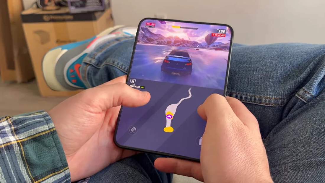 Asphalt Legends on an upright unfolded phone with racing above a large route map